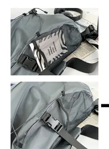 Detail of grey crossbody bag showing side mesh pocket, buckle, and durable texture