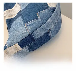 Detail of patchwork denim tote bag showing contrast stitching and high-quality fabric texture