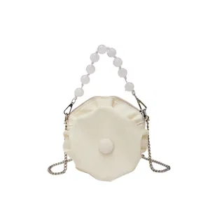 Chic pleated cloud bag in creamy white with pearl bead handle and gold chain strap