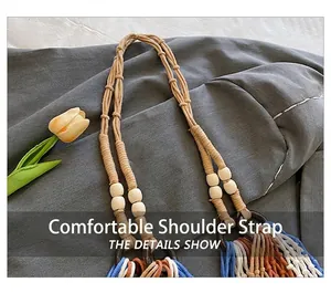 Detail of woven rope shoulder strap with wooden beads and colorful tassels on beach bag