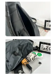 Detail view of the large capacity dark grey crossbody bag showing multi-pocket storage
