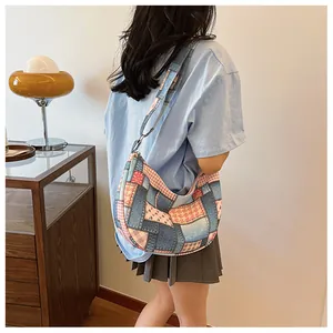 Detailed patchwork hobo bag with vintage denim and heart patterns in a lifestyle setting