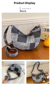 Detailed close-up of the vintage denim patchwork crescent bag in black with adjustable strap