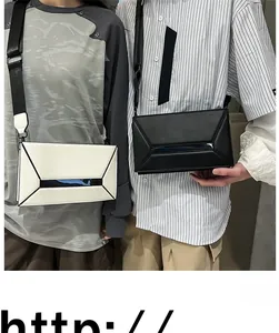 Detail showing two models wearing black and white geometric box bags with wide straps