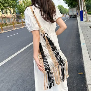 Handmade woven tassel shoulder bag with striped design and wooden ring accents