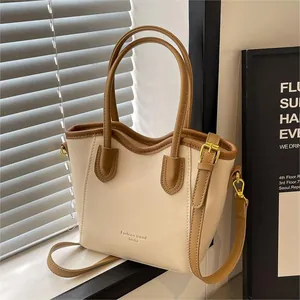 Contrast color bucket tote bag with brown handles and a white PU leather body