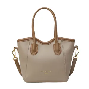 Contrast color bucket handbag in khaki and brown PU leather with adjustable shoulder strap