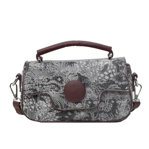 Retro grey jacquard handbag with brown leather handles and decorative round buckle