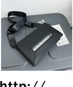 Detail showing the geometric folding design and clear PVC strip on this black crossbody bag