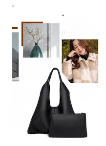 Detail of 2-in-1 black pebble leather tote and zip pouch with magnetic closure