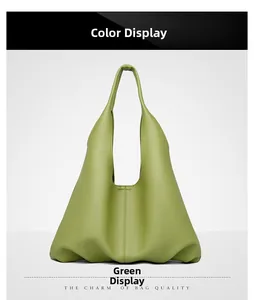 Detail view of large olive green soft leather hobo bag with pebble grain texture