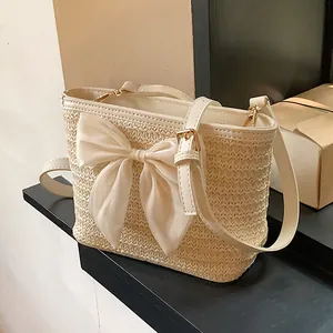 Women Straw Woven Bucket Bag Summer Beach Vacation Crossbody Bag With Ribbon Bow Floral Decor Adjustable PU Strap