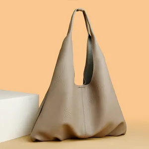 Large capacity soft leather hobo bag with pebble grain texture in neutral khaki tone