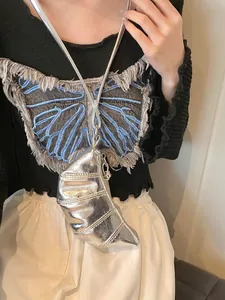 Chic silver metallic mini crescent bag with neck strap and quilted stitch texture