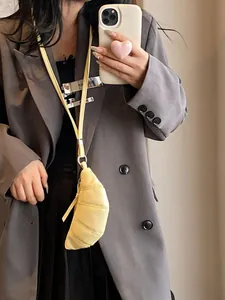 Minimalist pale yellow croissant shoulder bag with pleated leather texture for women