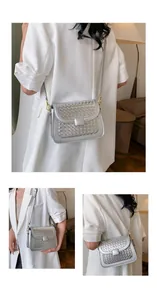 Detail of silver woven leather texture and square buckle on a stylish flap crossbody bag