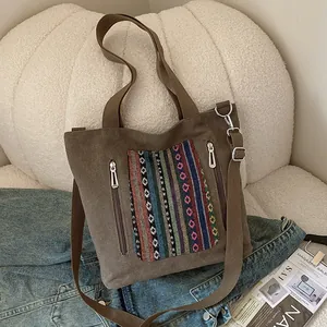 Vintage brown canvas tote bag with bohemian embroidery and adjustable shoulder strap