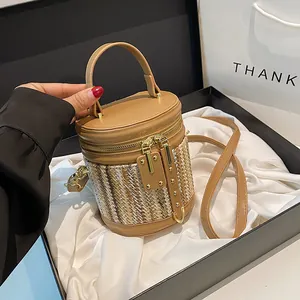 Contrast stitch straw cylinder handbag with leather handle and gift box presentation