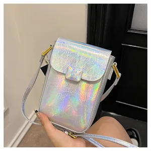 Close-up of holographic phone bag with pleated texture and golden metal hardware