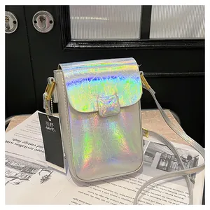 Detail of laser holographic silver mini phone bag with iridescent finish and magnetic flap
