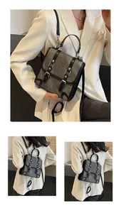 Detail of retro canvas backpack showing dual buckle straps and versatile carrying styles