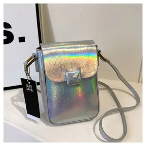Detailed macro shot of holographic silver mini crossbody bag showing premium laser texture
