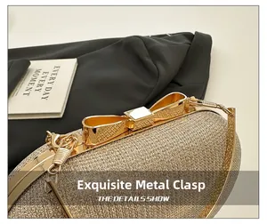 Close-up of exquisite bow-shaped metal clasp on golden sequin evening clutch bag