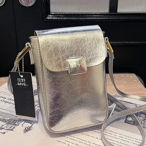 Metallic silver mini crossbody phone bag with crinkled texture and golden hardware