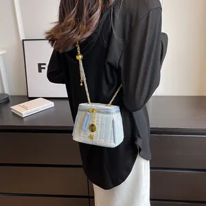 Chic light blue tweed chain crossbody bucket bag with floral gold hardware for women