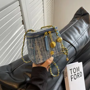 Mini blue and white striped tweed chain crossbody bag with floral gold ornament
