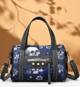 Detailed view of the skull and floral print fabric on the crossbody handbag