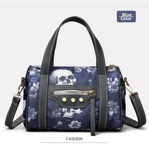 Blue Boston bag with skull and floral patterns featuring shiny nylon and gold studs