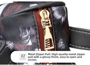 Detail of premium gold metal zipper pull on purple floral skull print crossbody bag