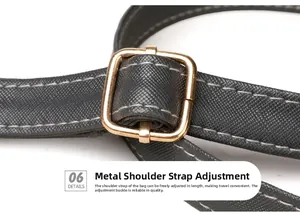 Close-up of adjustable cross-grain leather strap with golden metal buckle and stitching