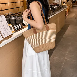 Summer woven straw tote bag with brown and beige stripes and faux leather handles