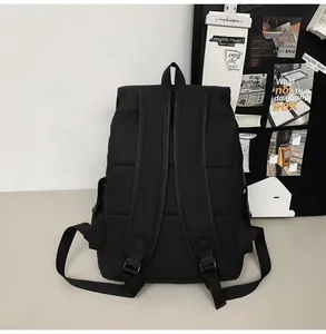 Detail of ergonomic padded back panel and adjustable shoulder straps on black backpack