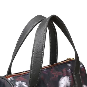 Detailed macro view of skull print handbag with high-quality cross-grain leather handles