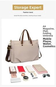 Detail of laptop tote bag capacity showing storage for A4 magazine, iPad, and umbrella