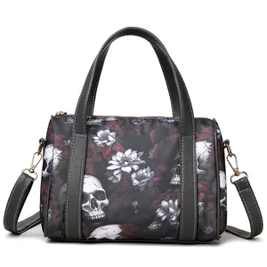 Detail of Boston bag showing skull floral print with gold-tone hardware and straps