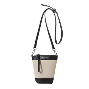 Sac seau tissé chic été 2024 avec bordure en cuir contrasté et bandoulière
