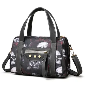 Detail of Boston bag showing skull floral print and signature gold-tone stud hardware