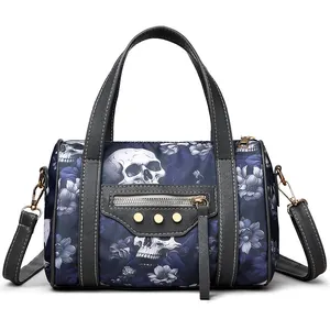 Macro shot of skull floral fabric texture and golden rivet details on the handbag