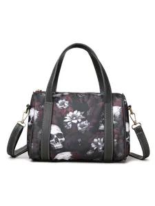 Detail of skull and floral print on women's tote bag with metal zipper and straps