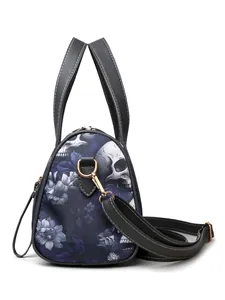 Close-up of gothic skull print on durable fabric with elegant gold-tone metal hardware