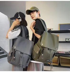 Gray and olive green large capacity city backpacks shown in use by models