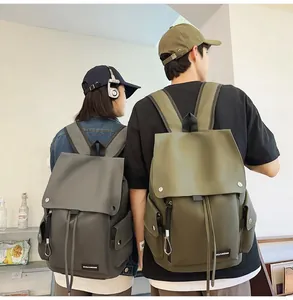 Lifestyle view of large capacity waterproof backpacks in dark grey and army green colors