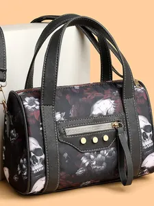 Gothic skull and floral print black Boston handbag with punk studs and top handle