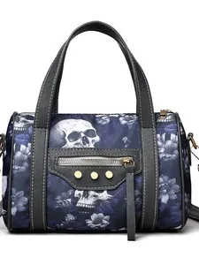 Chic skull floral print handbag in navy and purple with golden rivets and black trim