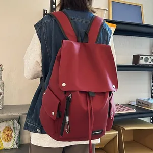 Minimalist large capacity dark red backpack with laptop compartment for college students