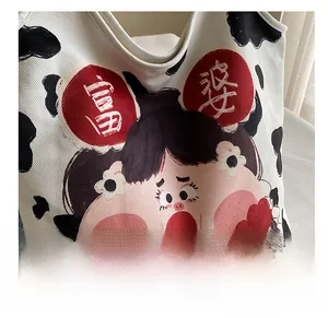 Detail of high-quality digital printing on cute cartoon canvas tote bag with cow pattern